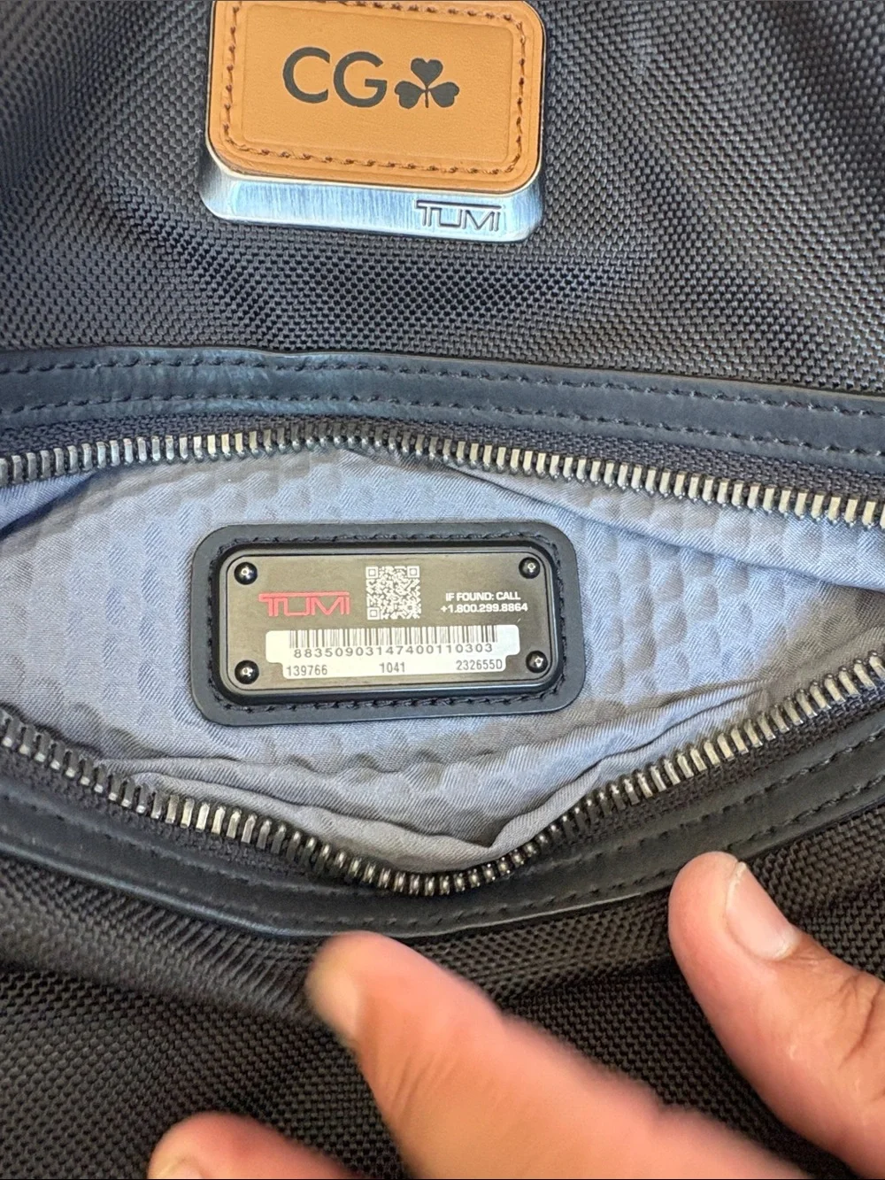 Tumi Black Backpack with Tan Accent